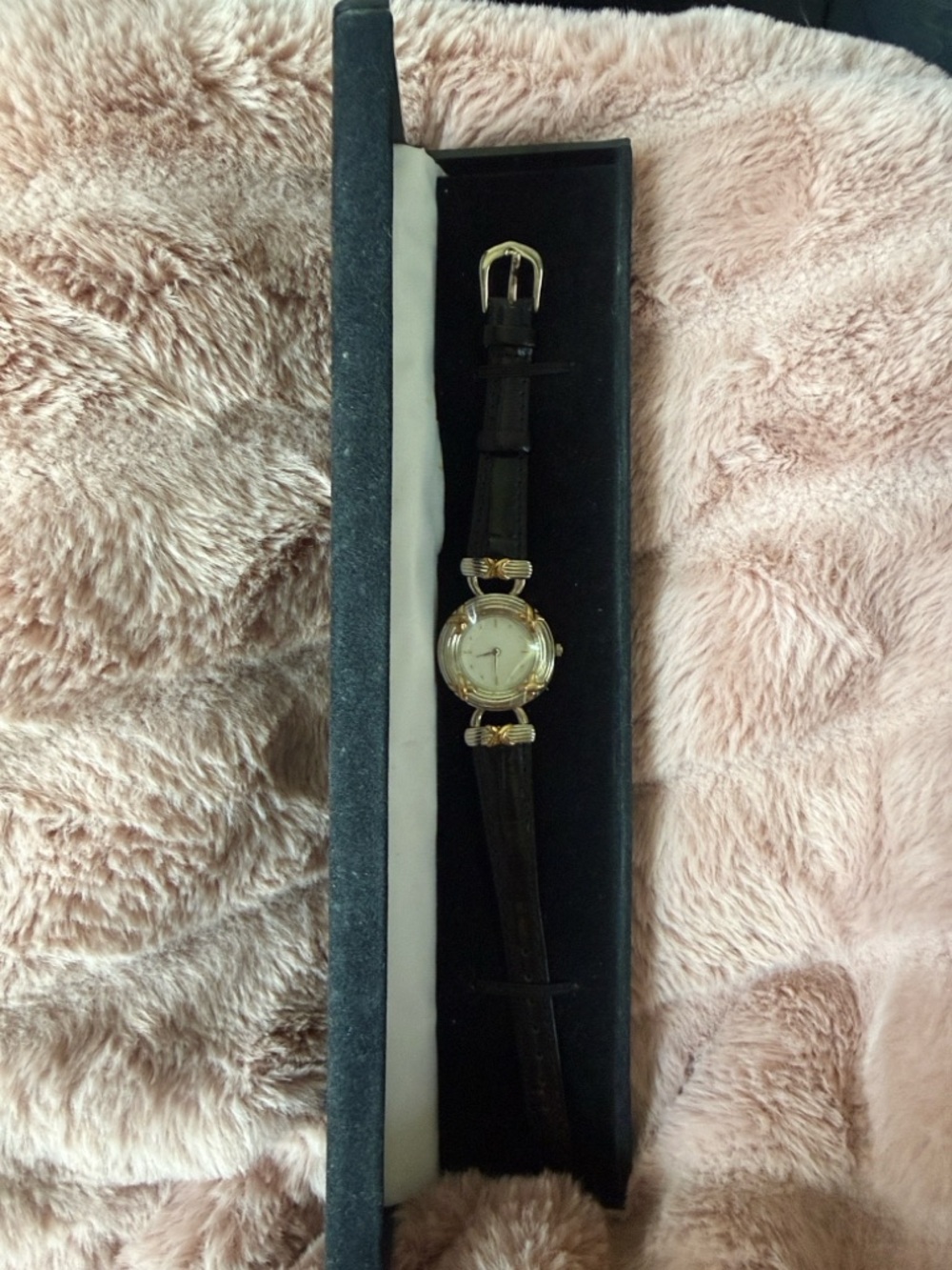 Vintage Avon Quartz Watch two tone with Black Leather Band needs a battery.